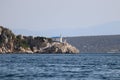 Closeup of a small white church built on a cliff by the seaside Royalty Free Stock Photo