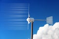 Closeup of a Small Wind Turbine against a Clear Blue Sky and Clouds Royalty Free Stock Photo