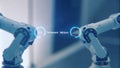 Closeup of a smart glass interface showing a holographic representation of robotic arms in motion alongside performance