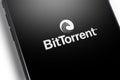 Closeup smartphone with BitTorrent logo