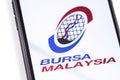 Closeup smartphone with Bursa Malaysia logo on the screen