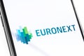 Closeup smartphone with Euronext logo on the screen