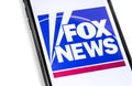 Closeup smartphone with FoxNews logo on the screen