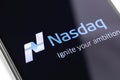 Closeup smartphone and Nasdaq logo on the screen