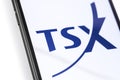 Closeup smartphone with TSX - Toronto Stock Exchange on the screen