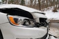 Closeup of smashed car after accident. Broken front of the vehicle after car crash in the city Royalty Free Stock Photo