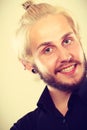 Closeup of smiling blonde man with piercing Royalty Free Stock Photo