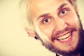 Closeup of smiling blonde man with piercing Royalty Free Stock Photo