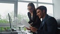 Closeup smiling managers working analysing documents computer data in office. Royalty Free Stock Photo