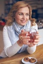 Smiling mature woman enjoying a cup of tea Royalty Free Stock Photo