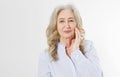 Closeup of smiling senior woman wrinkle face and gray hair. Old mature lady touching her wrinkled skin isolated on white Royalty Free Stock Photo