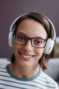 Closeup smiling teen girl with disability wearing headphones Royalty Free Stock Photo