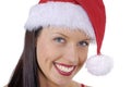 Closeup of smiling young adult woman with red Christmas Santa hat isolated on white Royalty Free Stock Photo