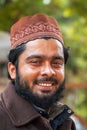 Closeup of smiling young Muslim man in Delhi.