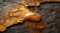 Closeup of a smooth golden liquid dripping down a cracked aged surface