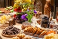 Closeup snacks, fresh and dried fruits, pieces parmesan cheese, honeycombs, dark chocolate, cinnamon sticks, nuts, biscotti. Royalty Free Stock Photo