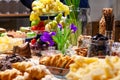 Closeup snacks, fresh and dried fruits, pieces parmesan cheese, honeycombs, dark chocolate, cinnamon sticks, nuts, biscotti. Royalty Free Stock Photo