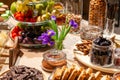 Closeup snacks, fresh and dried fruits, pieces parmesan cheese, honeycombs, dark chocolate, cinnamon sticks, nuts, biscotti.