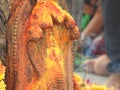 Closeup of Snake Statue in stone or Nagara Kallu in a Temple under the Pipal Tree doing puja during festival