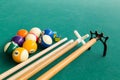 Closeup of snooker billards balls, chalk, cue and extender stick Royalty Free Stock Photo