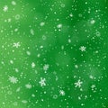 Closeup snowfall on green backdrop