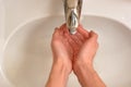 Closeup of soapy hands being washed