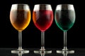 Closeup of some glasses with cocktails of different colors in nightclub