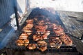 Closeup of some meat skewers being grilled in a barbecue Royalty Free Stock Photo