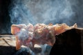 Closeup of some meat skewers being grilled in a barbecue Royalty Free Stock Photo