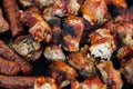 The closeup of some meat skewers being grilled in a barbecue. grilled meat skewers, barbecue Royalty Free Stock Photo