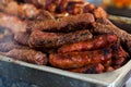 The closeup of some meat skewers being grilled in a barbecue. grilled meat skewers, barbecue Royalty Free Stock Photo