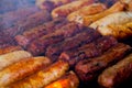 The closeup of some meat skewers being grilled in a barbecue. grilled meat skewers, barbecue Royalty Free Stock Photo