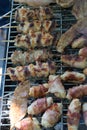 closeup of some meat on Wooden skewers being grilled in a barbecue. Grilling marinated shashlik on a coal grill. Food and Cuisine Royalty Free Stock Photo