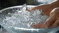 A closeup of someones hand immersed in a bowl of ice water a common technique for improving circulation and reducing Royalty Free Stock Photo