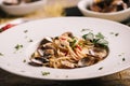 Closeup of spaghetti dish with clams on a white dish