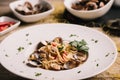 Closeup of spaghetti dish with clams on a white dish Royalty Free Stock Photo