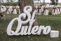 Closeup of a Spanish phrase Si Quiero under a tree in a wedding reception