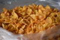 Closeup of spicy corn flakes in a polythene bag Royalty Free Stock Photo