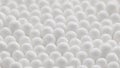 closeup spinning full-frame macro background of cotton earbud heads