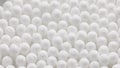 closeup spinning full-frame macro background of cotton earbud heads