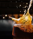 closeup splashes glass of dark Belgian beer Royalty Free Stock Photo