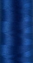 Closeup spool of blue thread