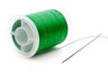 Closeup of a spool of thread and a need