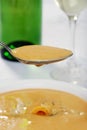 Closeup of spoonful cheddar cheese soup