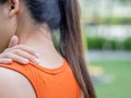 Closeup sport woman feel pain on her neck and shoulder