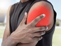 Closeup of sports man suffering from an inflamed shoulder injury. Athletic, active athlete holding and rubbing his sore