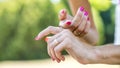 Closeup of spotted ladybug crawling on female hands Royalty Free Stock Photo