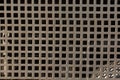 Closeup of the square holes perforated meshbackground Royalty Free Stock Photo