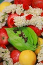 closeup Stack of betel leaf with fruits and flowers.