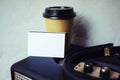 Closeup Stack Blank Business Card Portable Speaker.White Paper Mockup,Kraft Take Away Coffee Cup Empty Wall Background Royalty Free Stock Photo